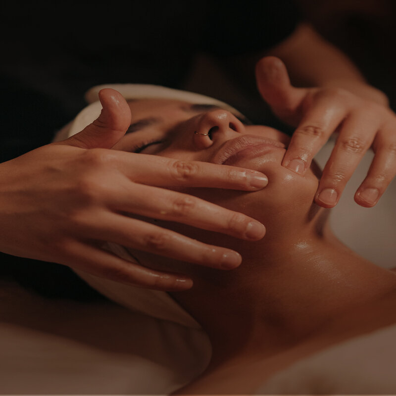 Woman gets a facial treatment.